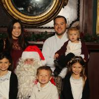 Family of six and Santa Claus